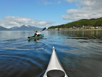 Image of kayakers on the water at Tenakee Springs, Alaska